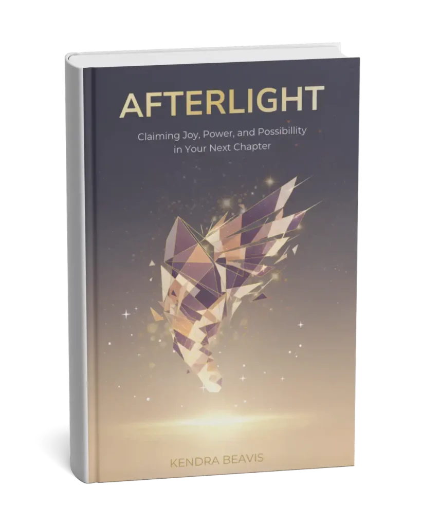 A hardcover book titled AFTERLIGHT by Kendra Beavis. The cover features a geometric, faceted butterfly in gold and purple tones, with sparkles around it, and a soft gradient background.